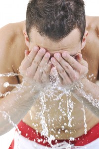 Man washing his face