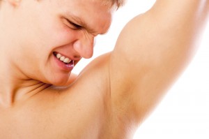 Man looking on his underarm