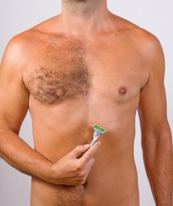 Man shaving his chest